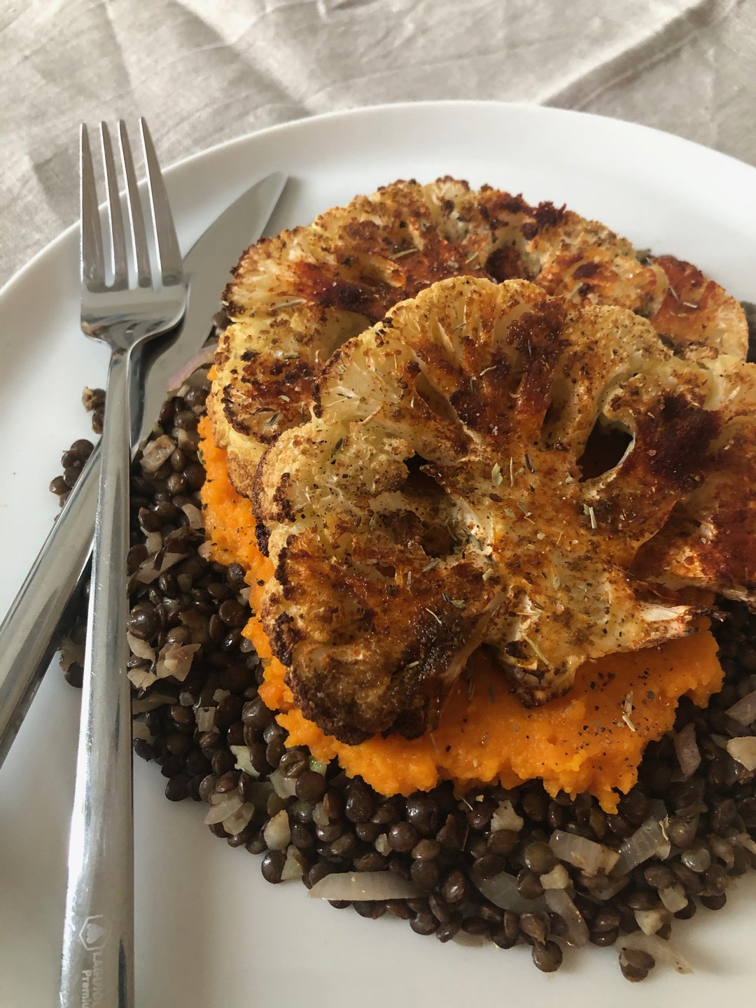 Cauliflower steak with carrots and lentils