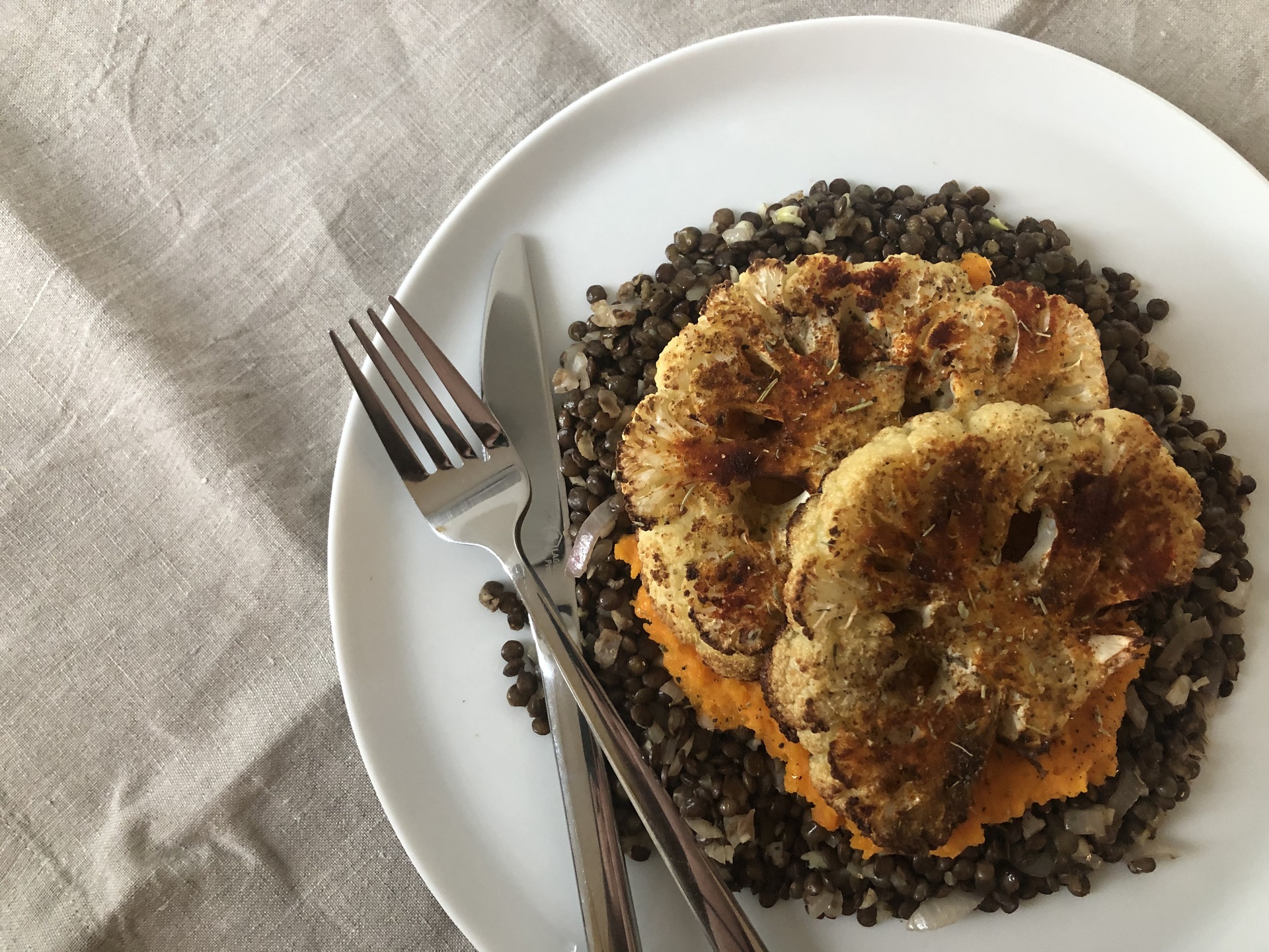 Cauliflower steak with carrots and lentils